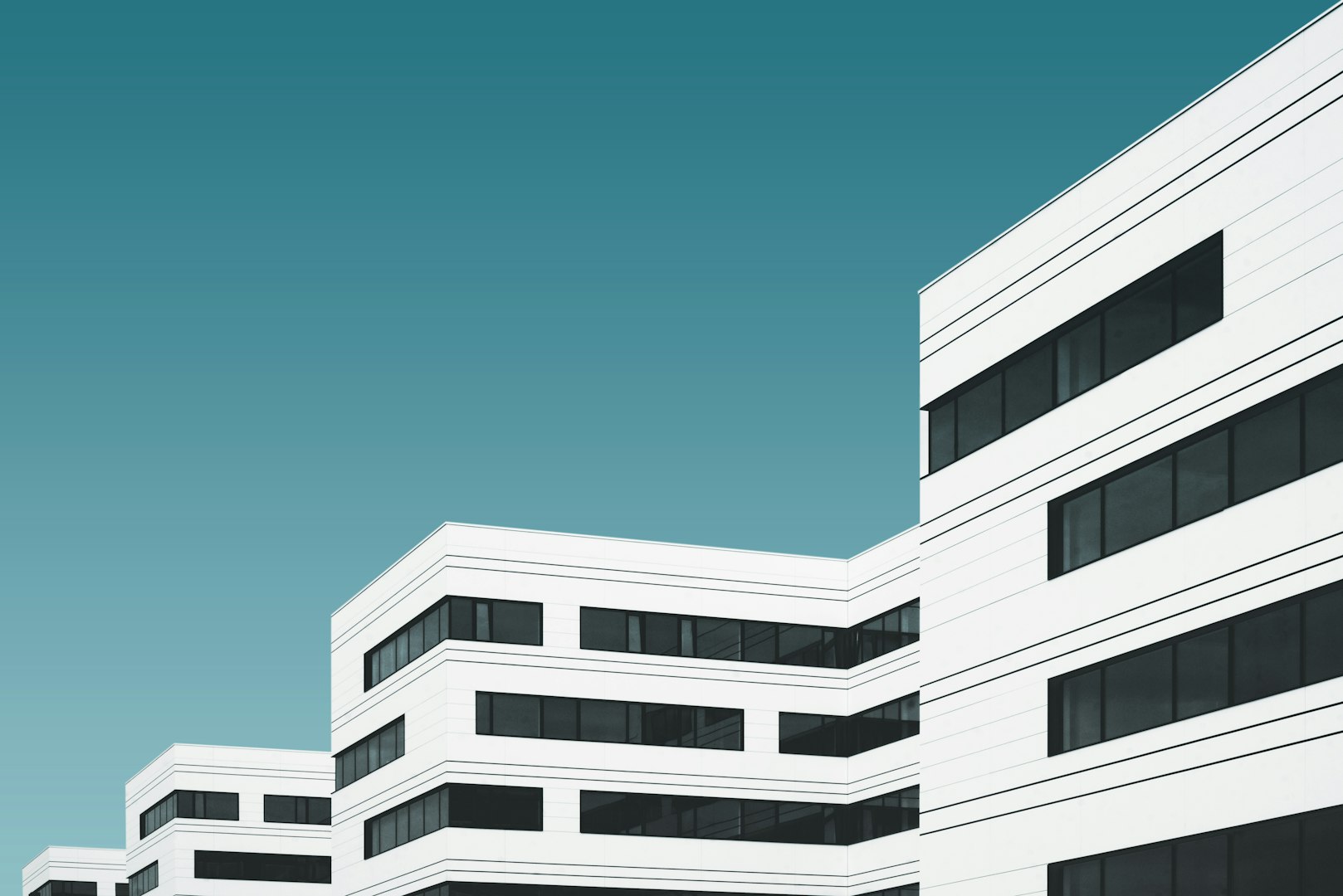 A modern hospital exterior featuring clean brickwork, large windows, and professional landscaping — highlighting quality masonry in healthcare and institutional settings.
